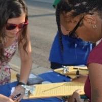 GVSU Education Alumni sign in registrants at volunteer event